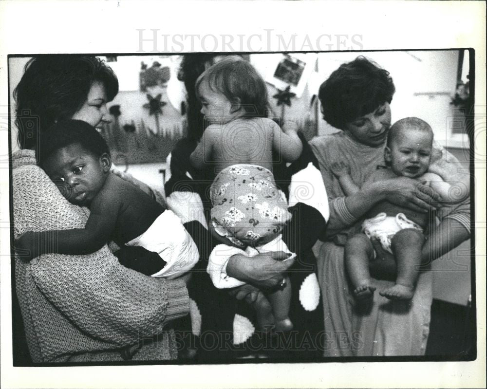 1993 Press Photo Rainbow Rascals staffers with babies - Historic Images