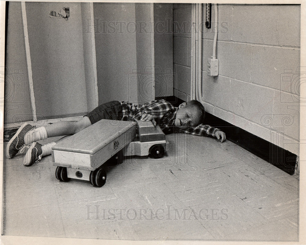 1970 Young boy playing with toy truck-Historic Images