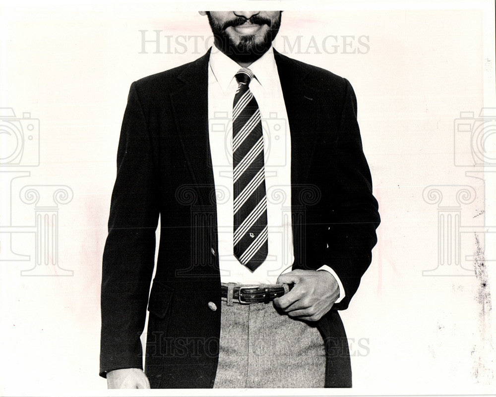 1984 perfectly tied tie to top of belt-Historic Images