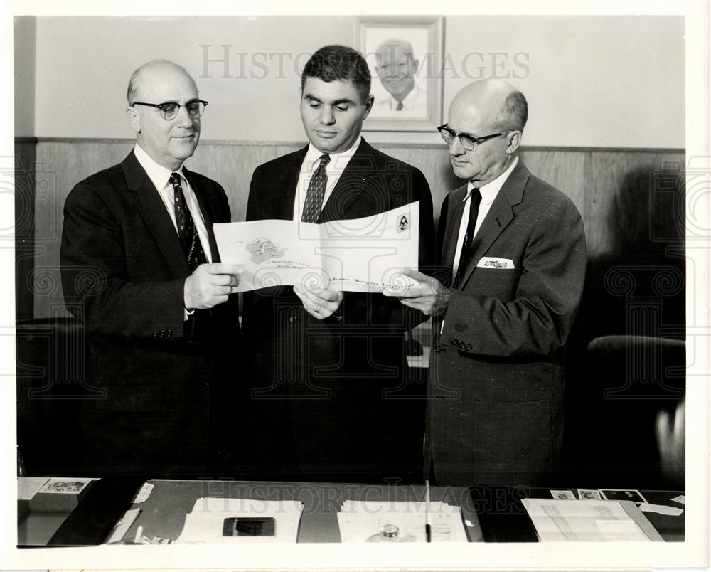  1957 James. A. Conway looks at fiscal year - Historic Images