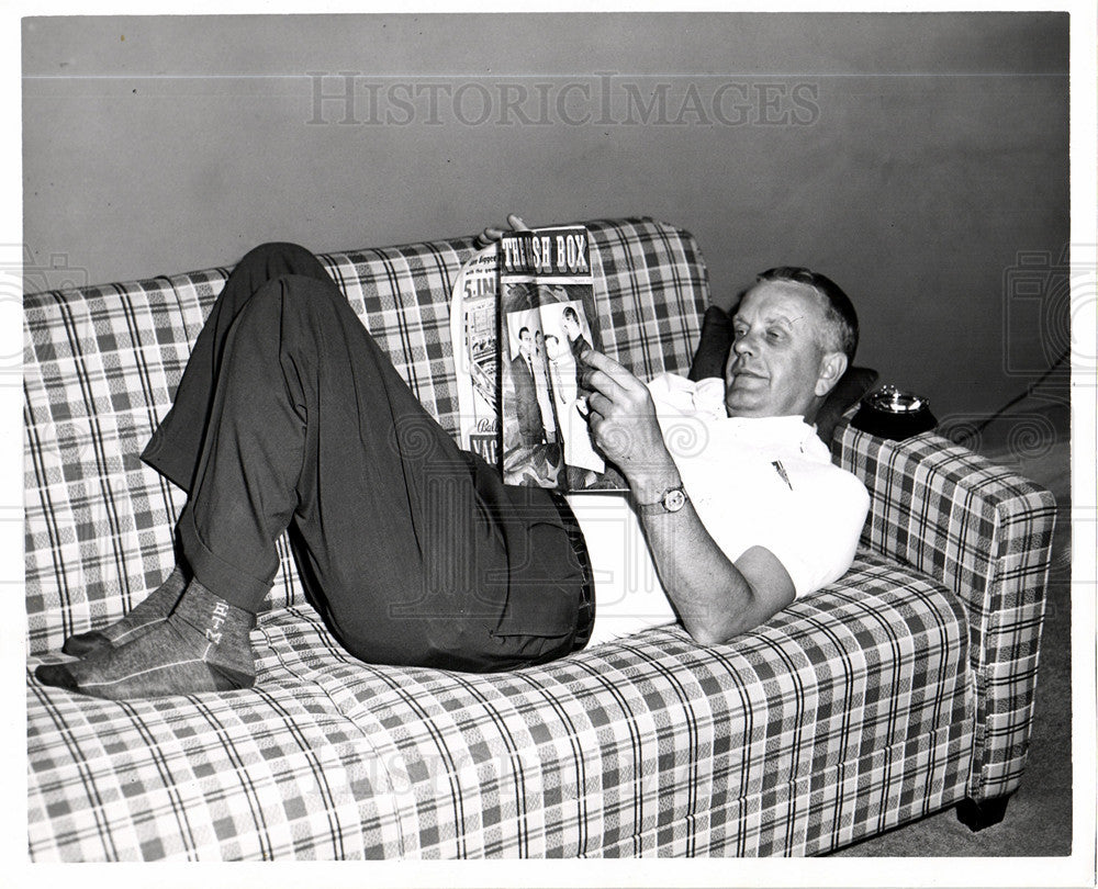 Press Photo Record Producer Reads Magazine - Historic Images