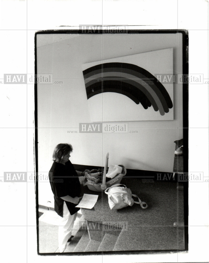 1993 Press Photo AN EMPLOYEE WATCHES OVER AN INFANT - Historic Images