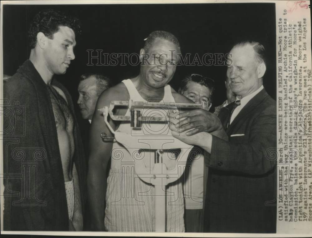 1962  Clayton Frye weighs Boxer Archie Moore for his coming fight-Historic Images