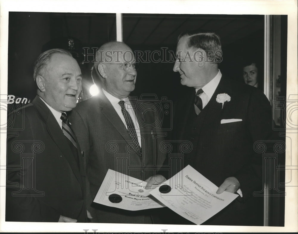 1956 Press Photo Bank executive receive certificates, Bank of Texas, Houston - Historic Images