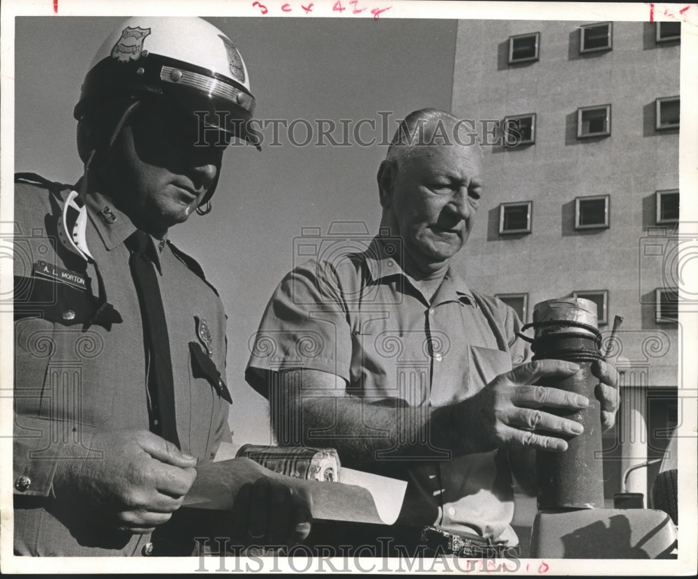1968 Press Photo A. L. Morton and J. E. Armstrong examine rocket, Houston - Historic Images