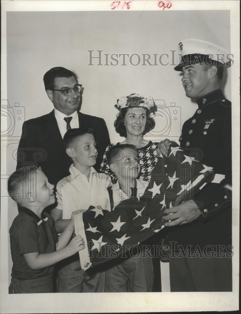 1956 Press Photo Robert D. Maine Shows Naturalization Family How to Fold Flag. - Historic Images