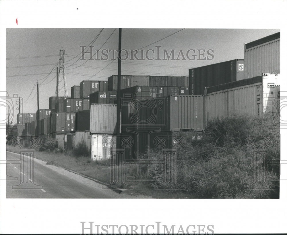 1991 Press Photo Stacks of containers alongside the road - hca13469 - Historic Images