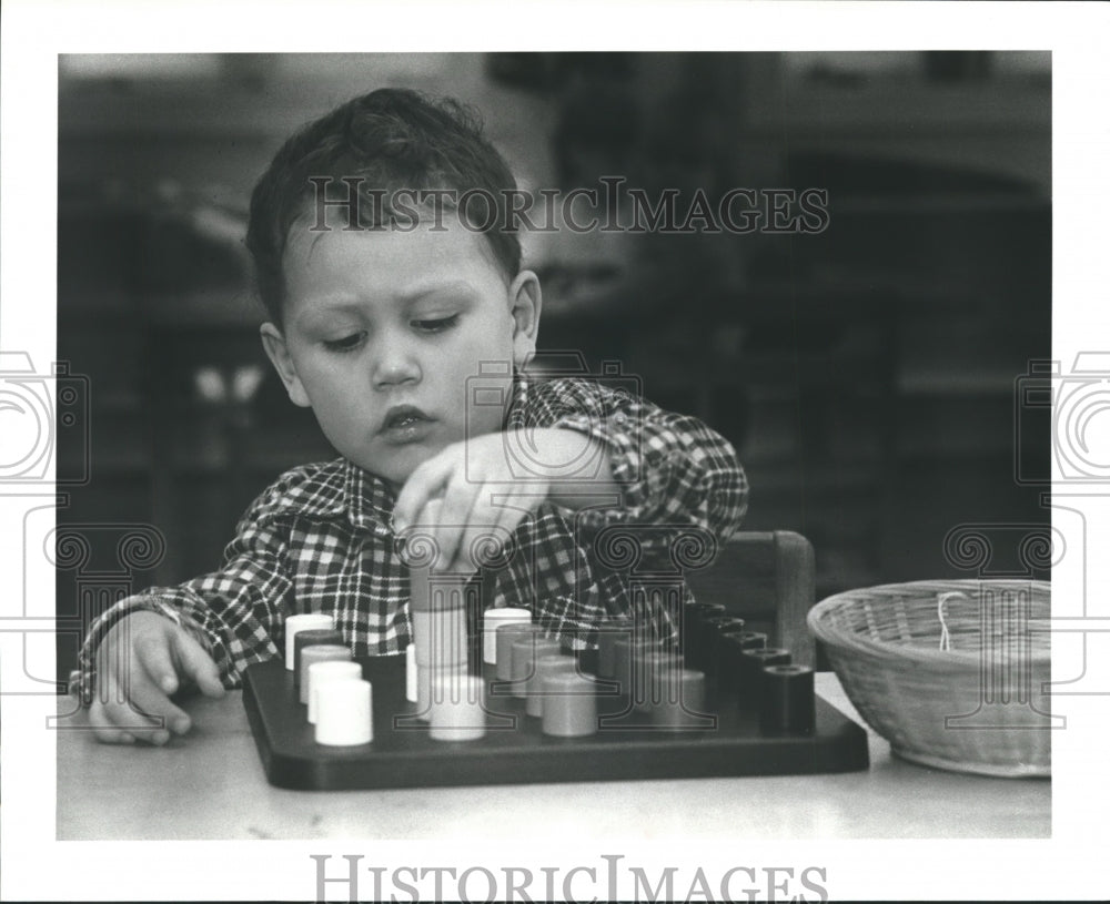 1983 Press Photo Michael Sustaita plays blocks at Cathedral House School, Texas - Historic Images