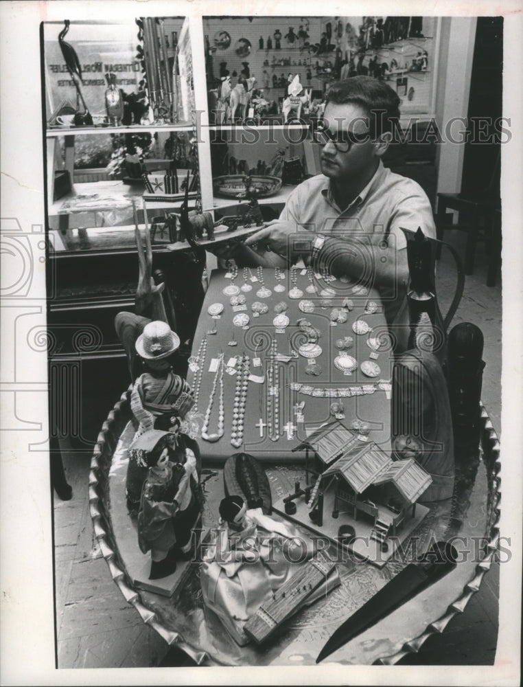 1966 Press Photo Jim Bordin with gifts at Church World Service Center - Historic Images