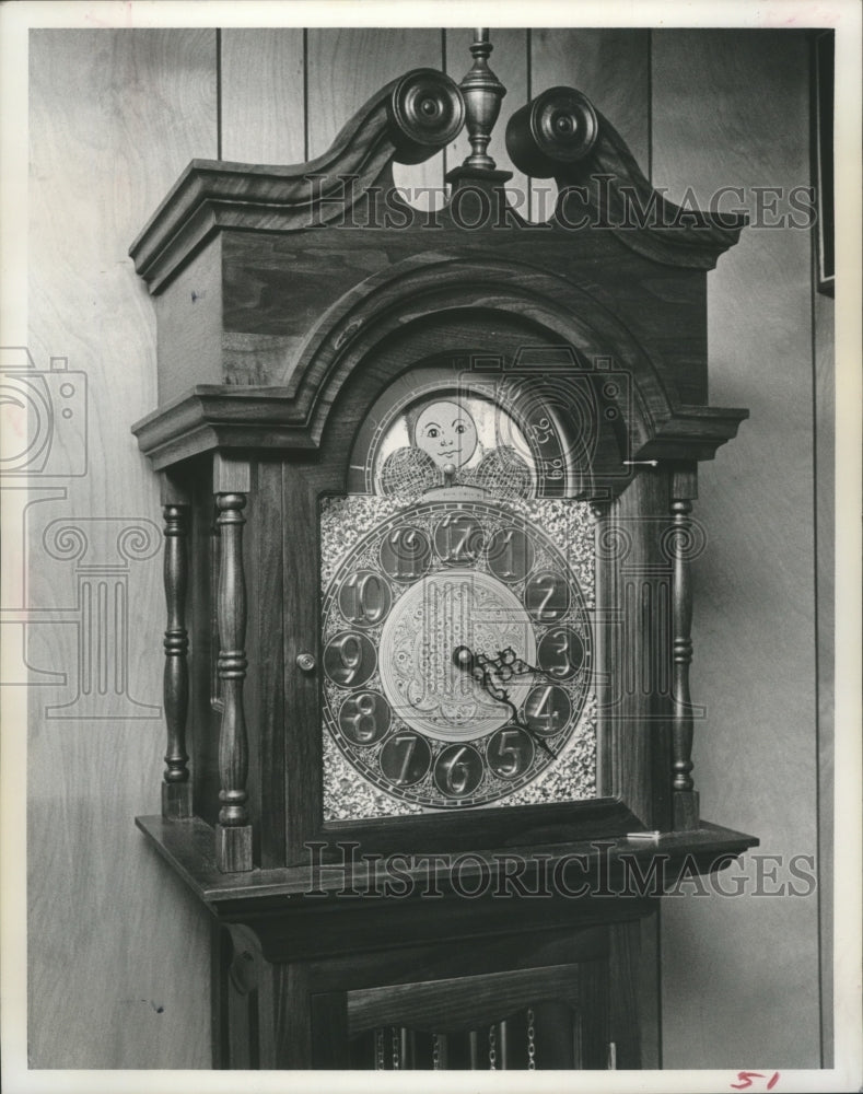 1975 Grandfather clock with golden moving moon dial - Historic Images