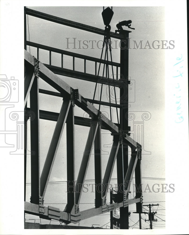 1990 Iron worker atop trusses on roof at Cleveland State University - Historic Images