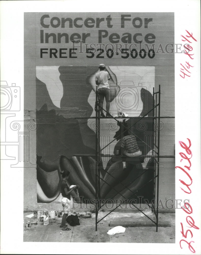 1992 Workmen prepare poster for Concert for Inner Peace, Houston - Historic Images