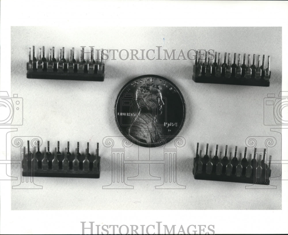 1988 Press Photo Computer chips compared to the size of a penny - hca15355 - Historic Images