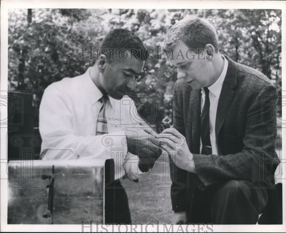 1962 Press Photo M. K. Towfique Discusses Solar Film With Dr. Robert Walker. - Historic Images