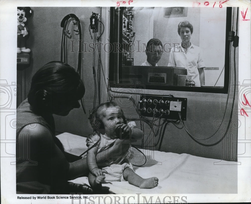 1969 Press Photo Research Technicians Do Study on Baby Using Computer Equipment. - Historic Images