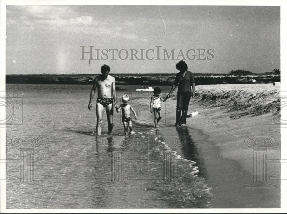 1982 Family enjoys walk on beach in Cyprus Island - Historic Images