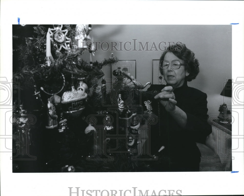 1990 Mrs. Connie Howell Enjoying Christmas Tree Decorations, Houston - Historic Images