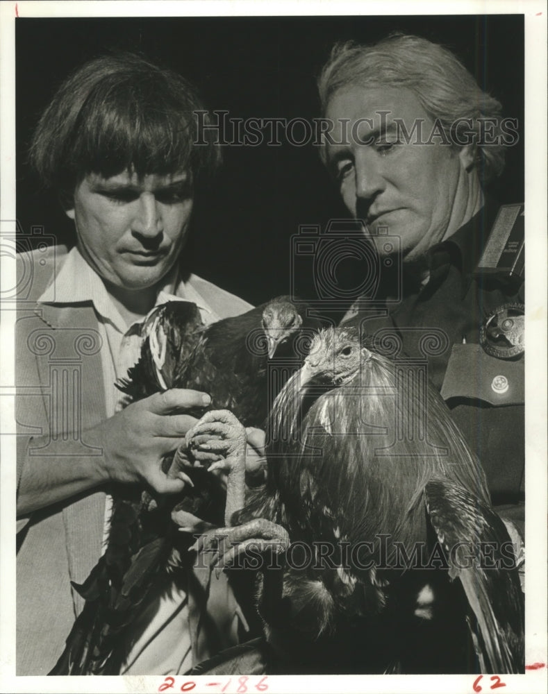 1982 George Huebner and Guy Clark with Cockfight rooster, Houston - Historic Images