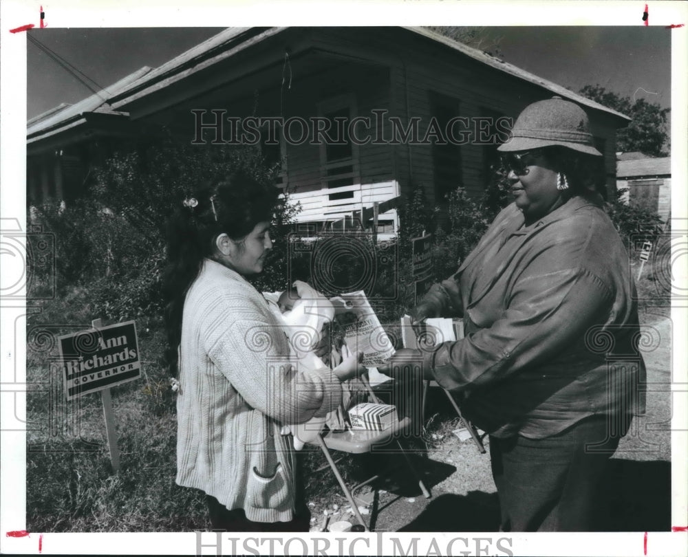 1990 Esther Cruz Takes An TX Election Flyer From Bertha Whitefield. - Historic Images