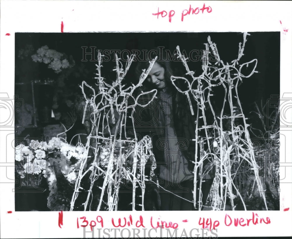 1992 Press Photo Alice DeLos Santos with reindeer Christmas decoration, Houston - Historic Images