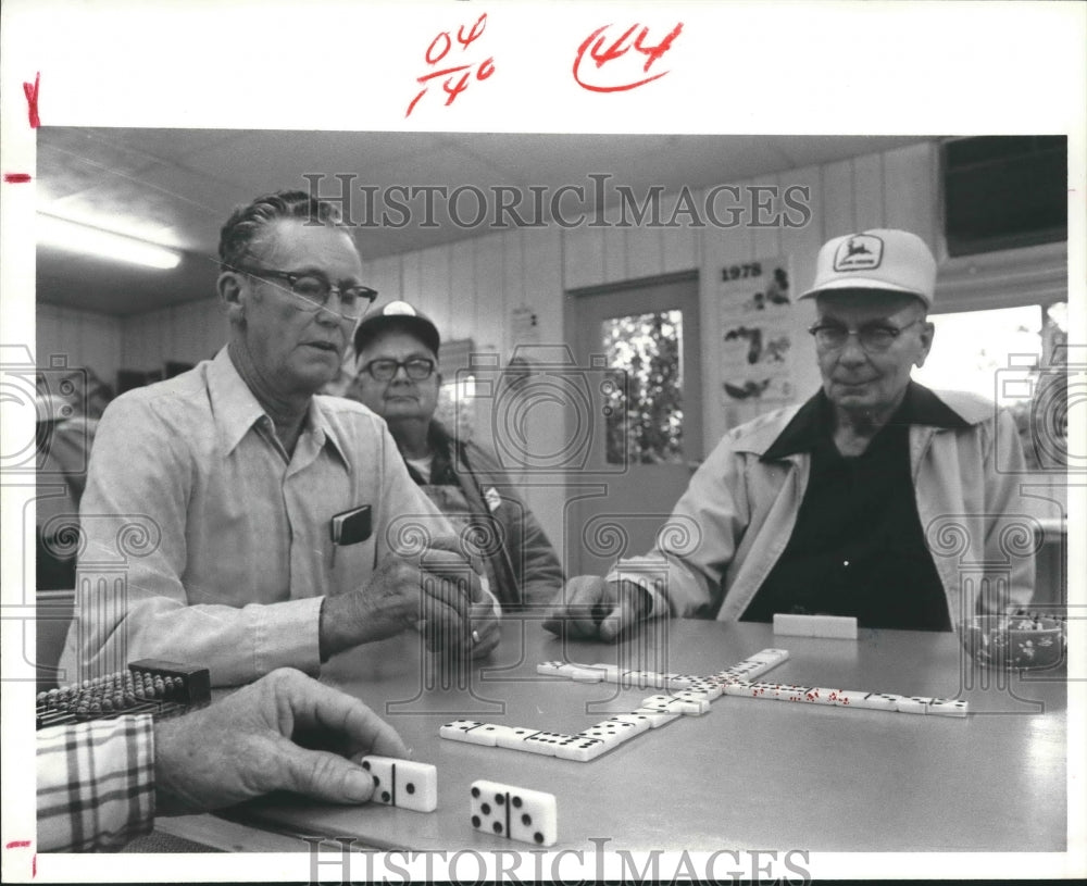 1978 Elderly gentlemen enjoy a game of Dominoes, Emerald RV Park - Historic Images