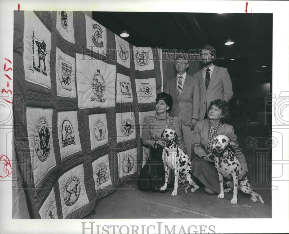 1984 Dalmations and owners look at quilt of club logos - Historic Images