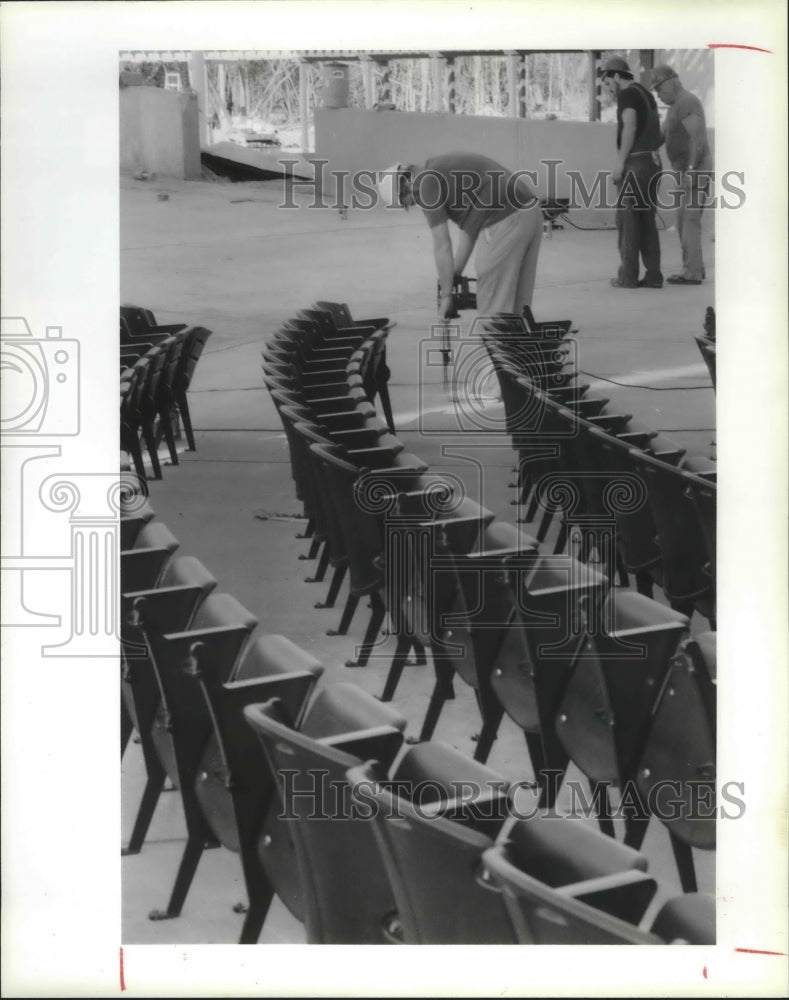 1990 Workers Installing Seats In Cynthia Woods Mitchell Pavilion. - Historic Images