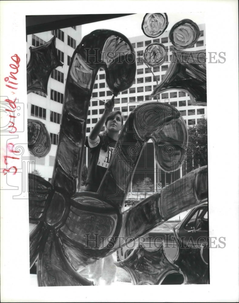 1990 Art Institute of Houston student paints Christmas decorations - Historic Images