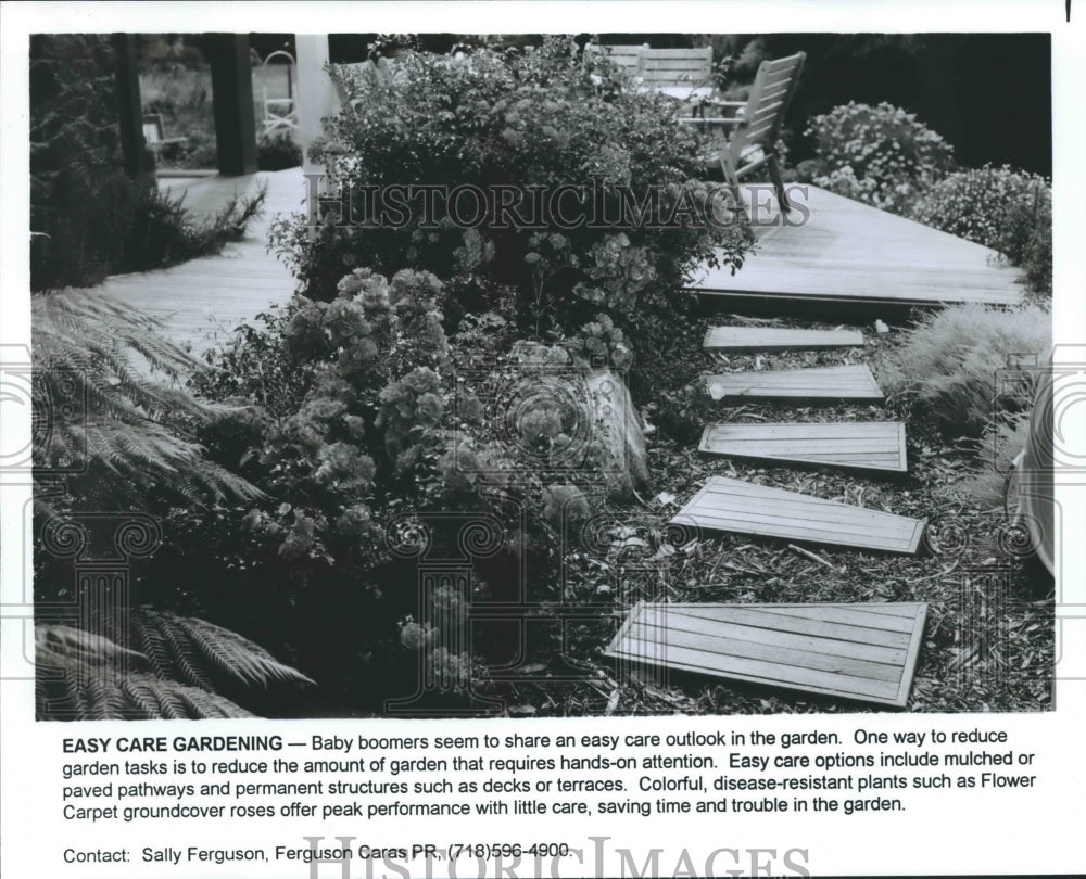 1996 Easy Care Garden with wooden walkway and deck - Historic Images