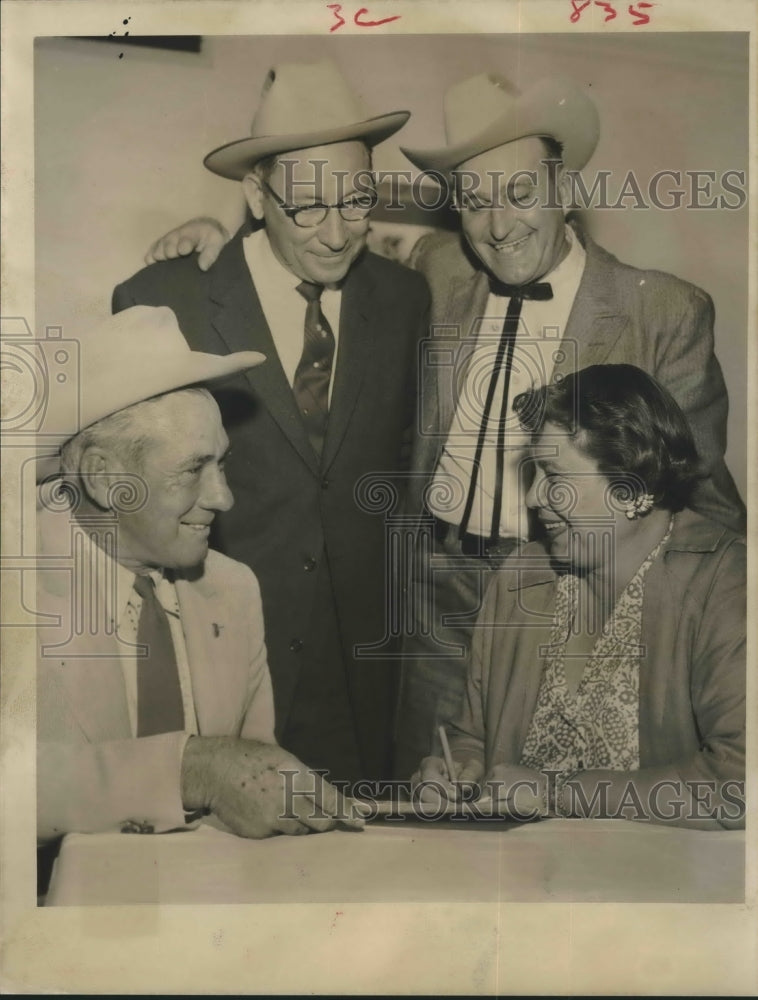 1958 Press Photo Officials discuss party at Fort Bend County, Texas - hca19756 - Historic Images