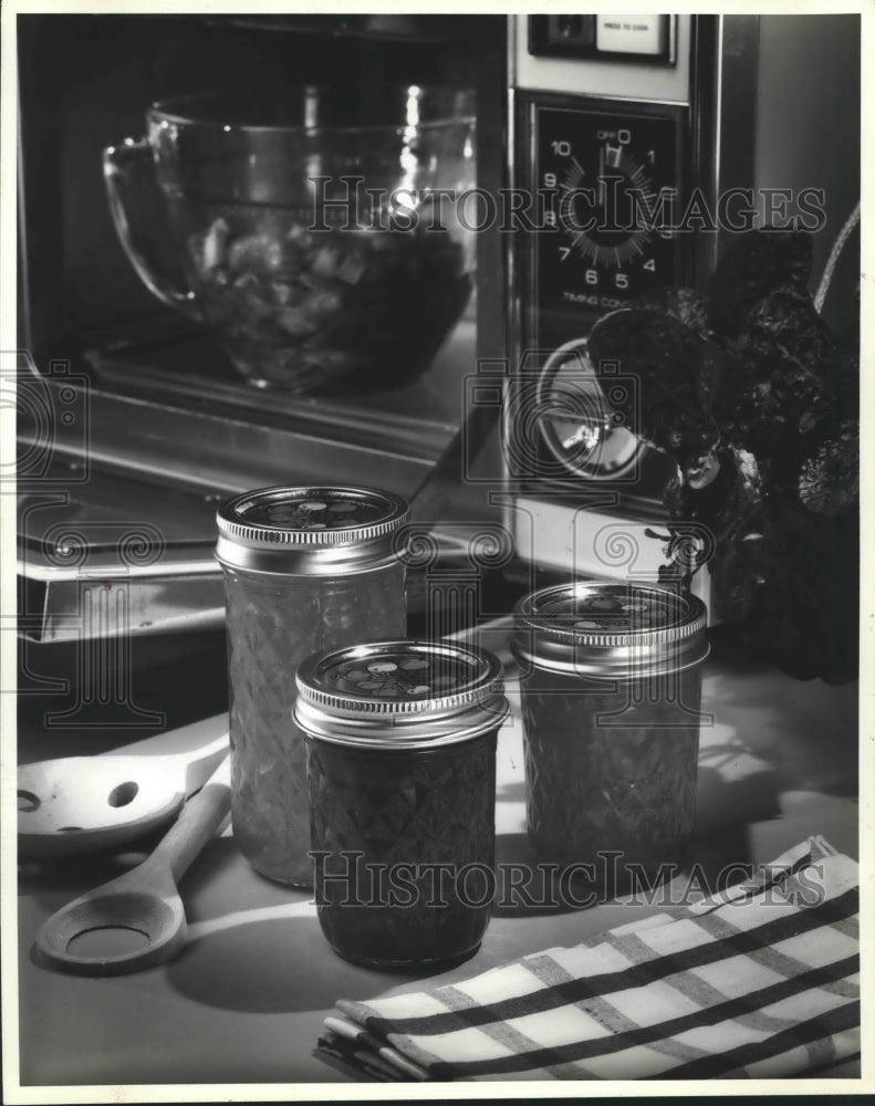 1981 Microwaving Food &amp; Jars of Fruit. - Historic Images