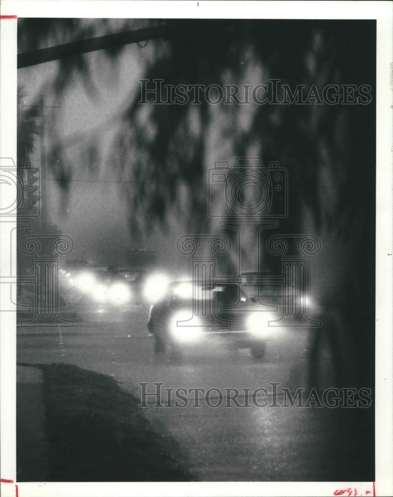 1980 Cars driving in heavy fog in downtown Houston - Historic Images