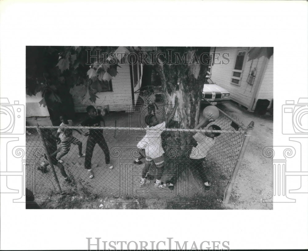 1990 Kids Play Basketball in Fifth Ward, Houston. - Historic Images