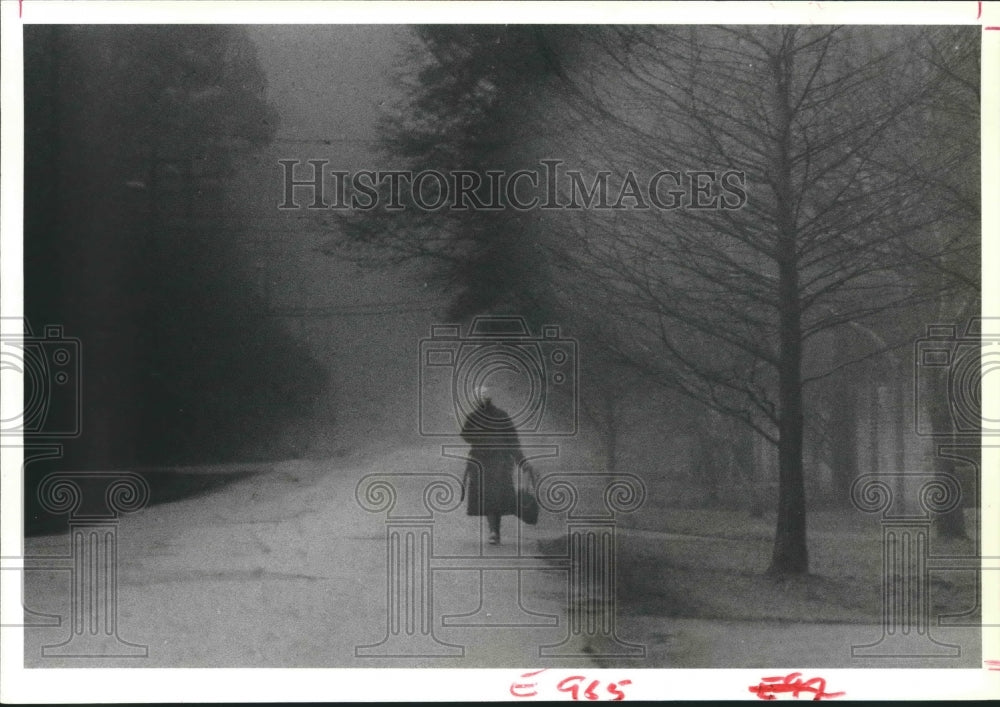 1979 Willia Ellis walking to work in the Houston fog - Historic Images