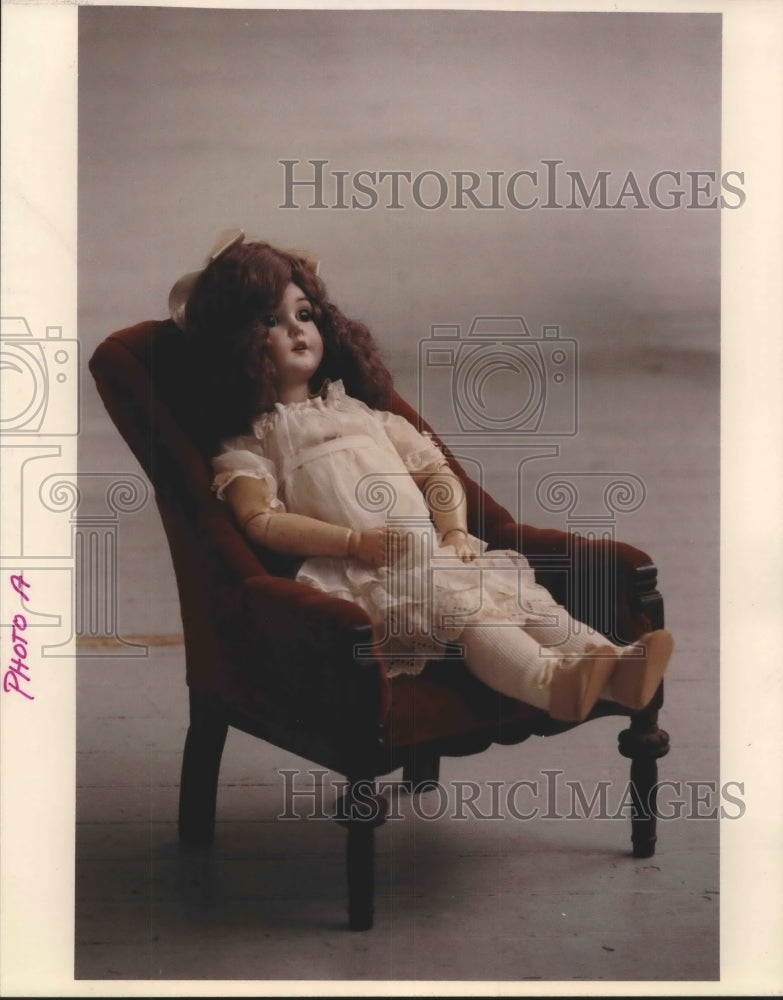 1992 Press Photo Doll Sitting in Chair. - hca20193 - Historic Images