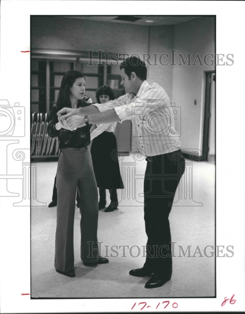 1983 Lewis Altenburg instructs Suzy Williams about dancing - Historic Images
