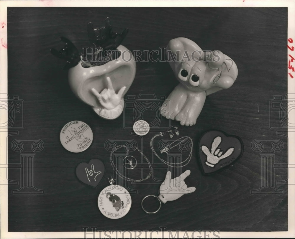 1981 Symbols for 'I love you' in sign language for the deaf - Historic Images