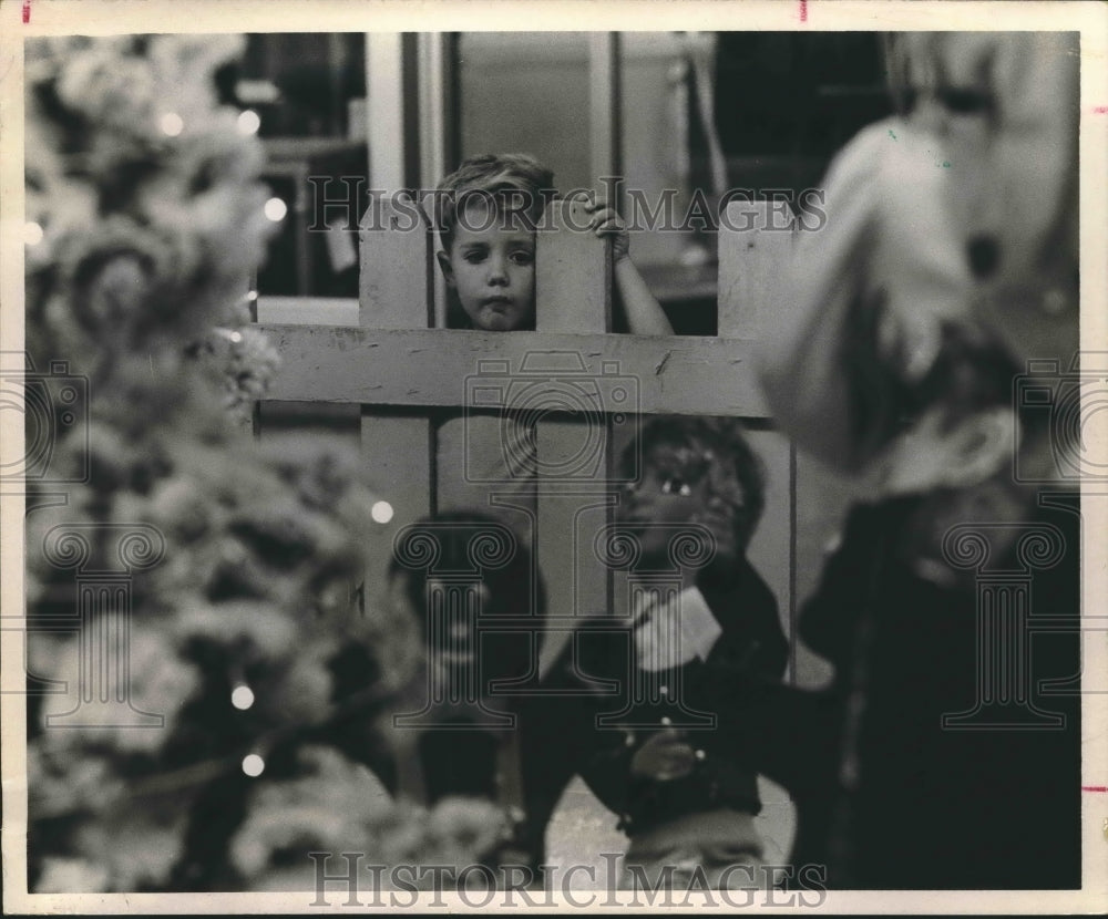 1970 Kelly Haynie Watches Christmas Decorations  At Gulfgate Center. - Historic Images