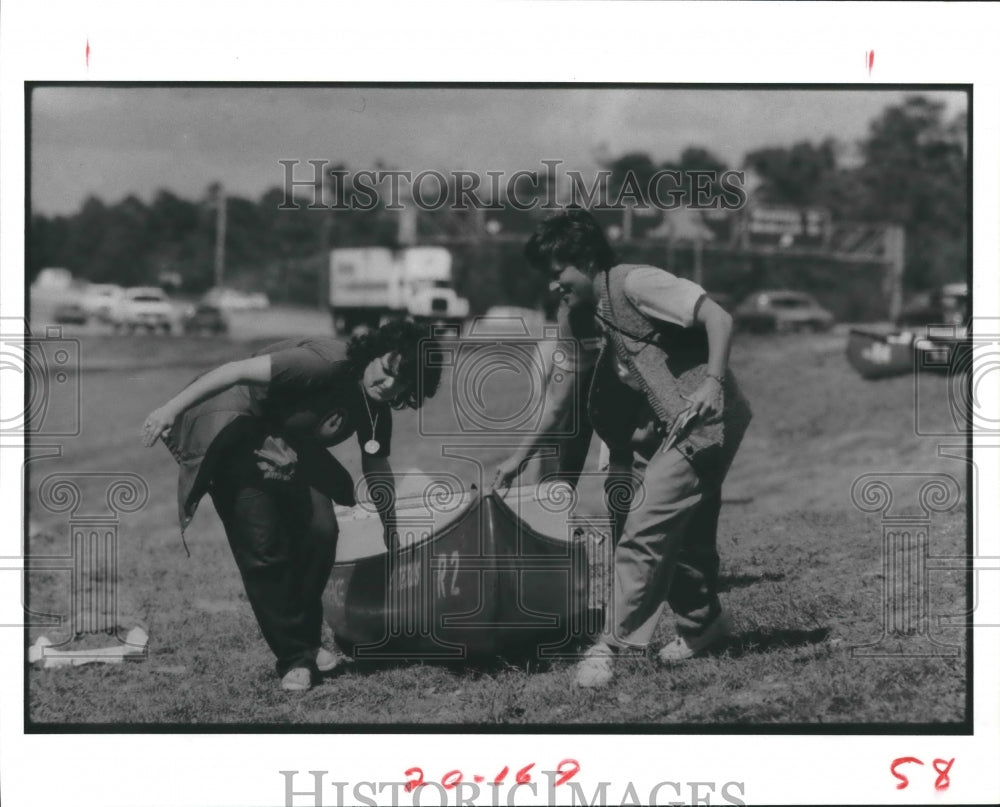 1984 Women with canoe - Historic Images