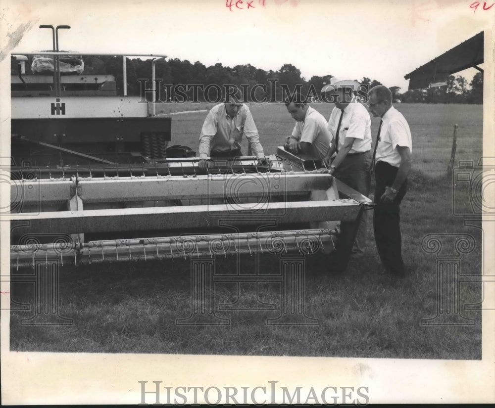 1967 Press Photo Men inspect new $8000 grass cutter - Texas - hca21453 - Historic Images