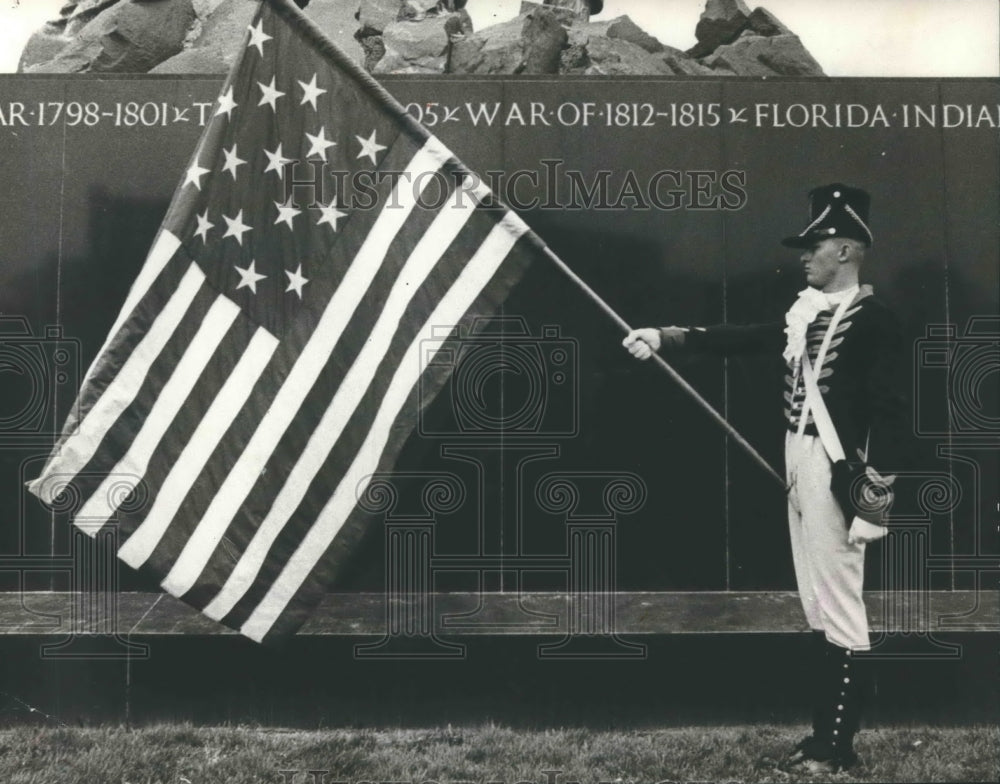 1976 Soldier with flag in front of monument - Flags - U.S.-Historic Images