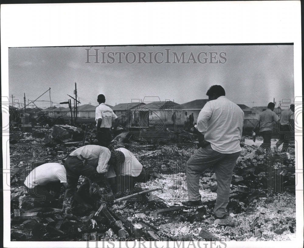 1969 Press Photo Man watches firemen sift through wreckage, Greenridge North - Historic Images