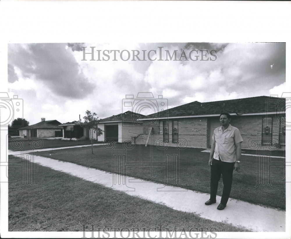 1969 Press Photo Man stands in front of Wreckage at Greenridge North Subdivision - Historic Images