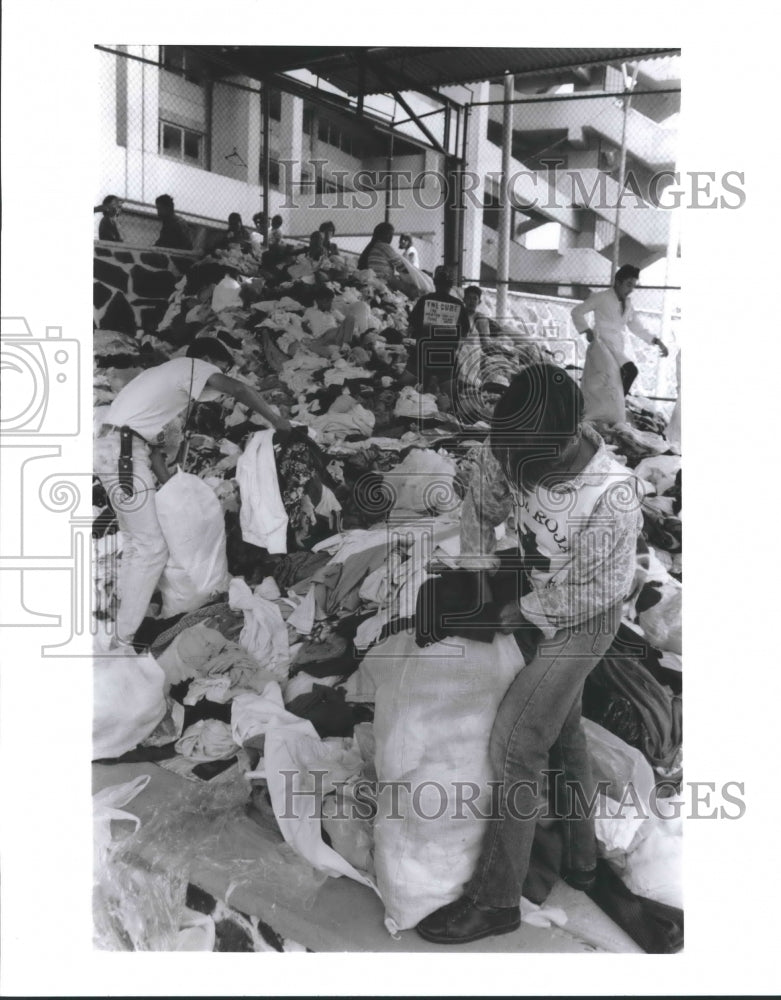 1992 Red Cross workers sort donations in Guadalajara, Mexico - Historic Images