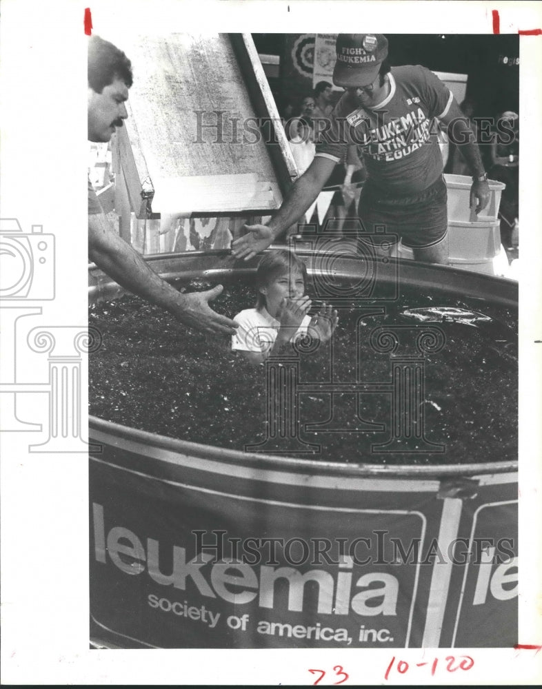 1984 Robin Sill sits in gelatin to raise money for Leukemia Telecast - Historic Images