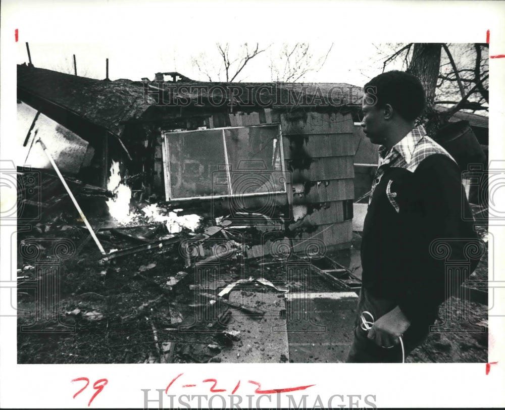 1979 Arthur Polley surveys the remains of his house in Houston, TX - Historic Images