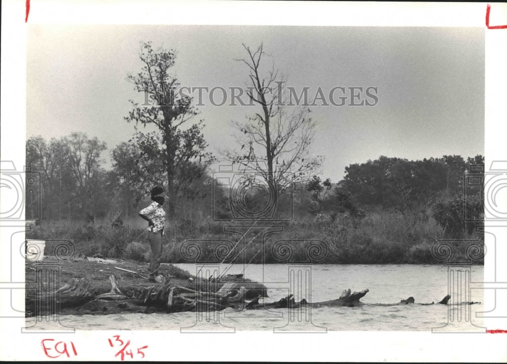 1980 Woman fishing at Lake Livingston, Texas. - Historic Images