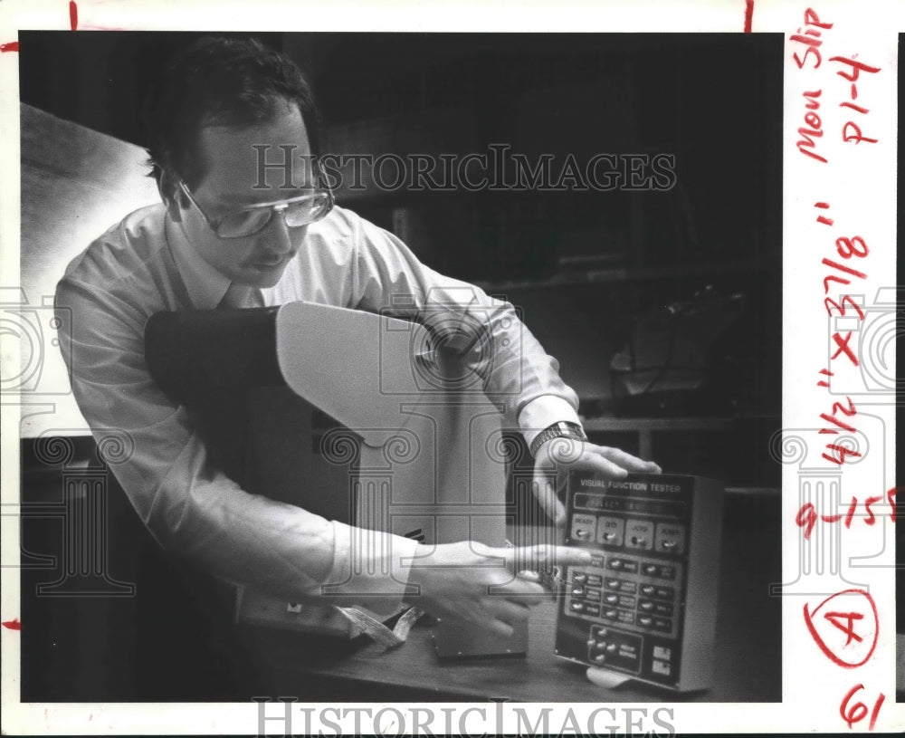 1981 Charles Kurtzman demonstrates new glaucoma testing equipment - Historic Images