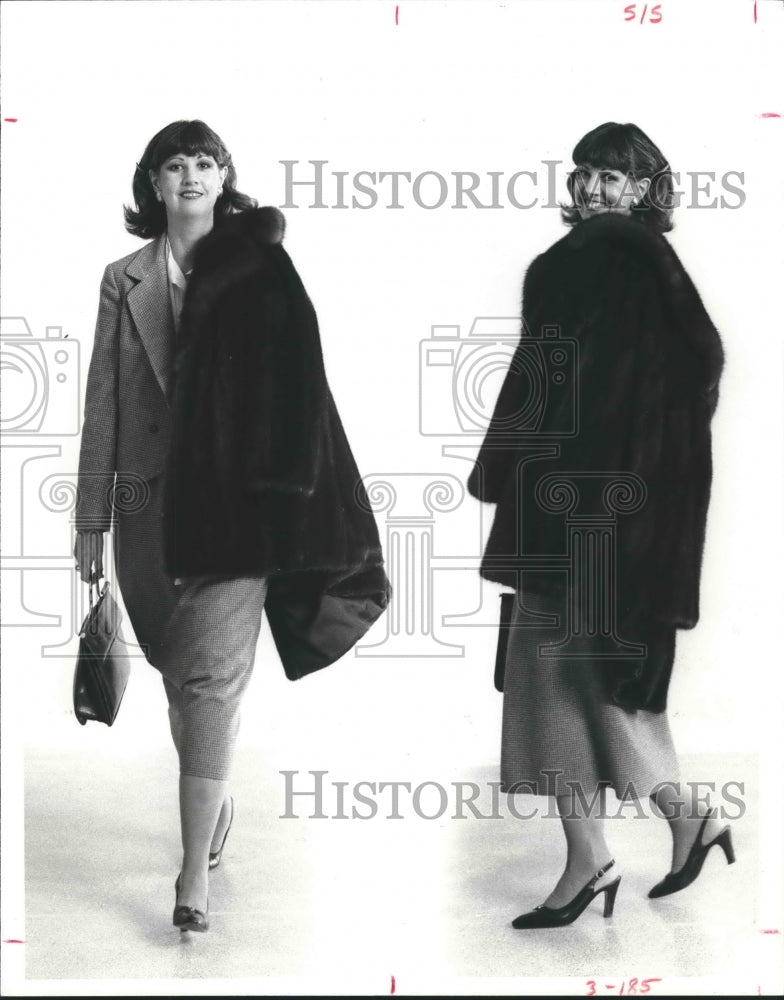 1979 Woman models mid-length fur coat in Houston, TX - Historic Images