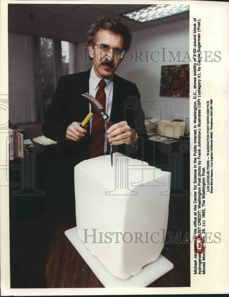 1994 Michael Jacobson with 50-pound block of fat, Washington, D.C. - Historic Images